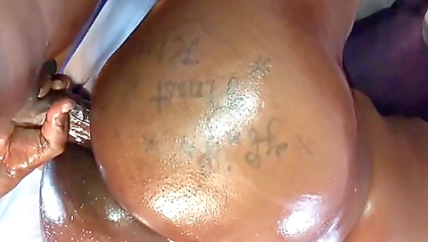 Ebony tattooed woman rides big cock and fucks her ass