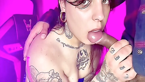 A tattooed brunette is having a good time with her neighbor